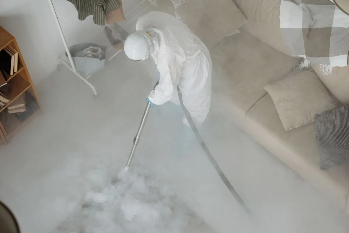 Biohazard cleanup technician in protective equipment, Lincoln City, OR